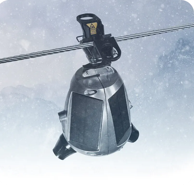 Sentri device hanging from a power line in snow conditions